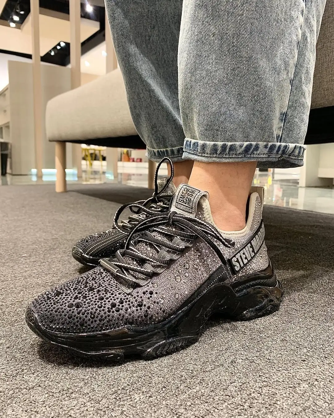 casual friday summer outfits with sneakers 2026 Glossy Black Sneakers with Everyday Denim Edge