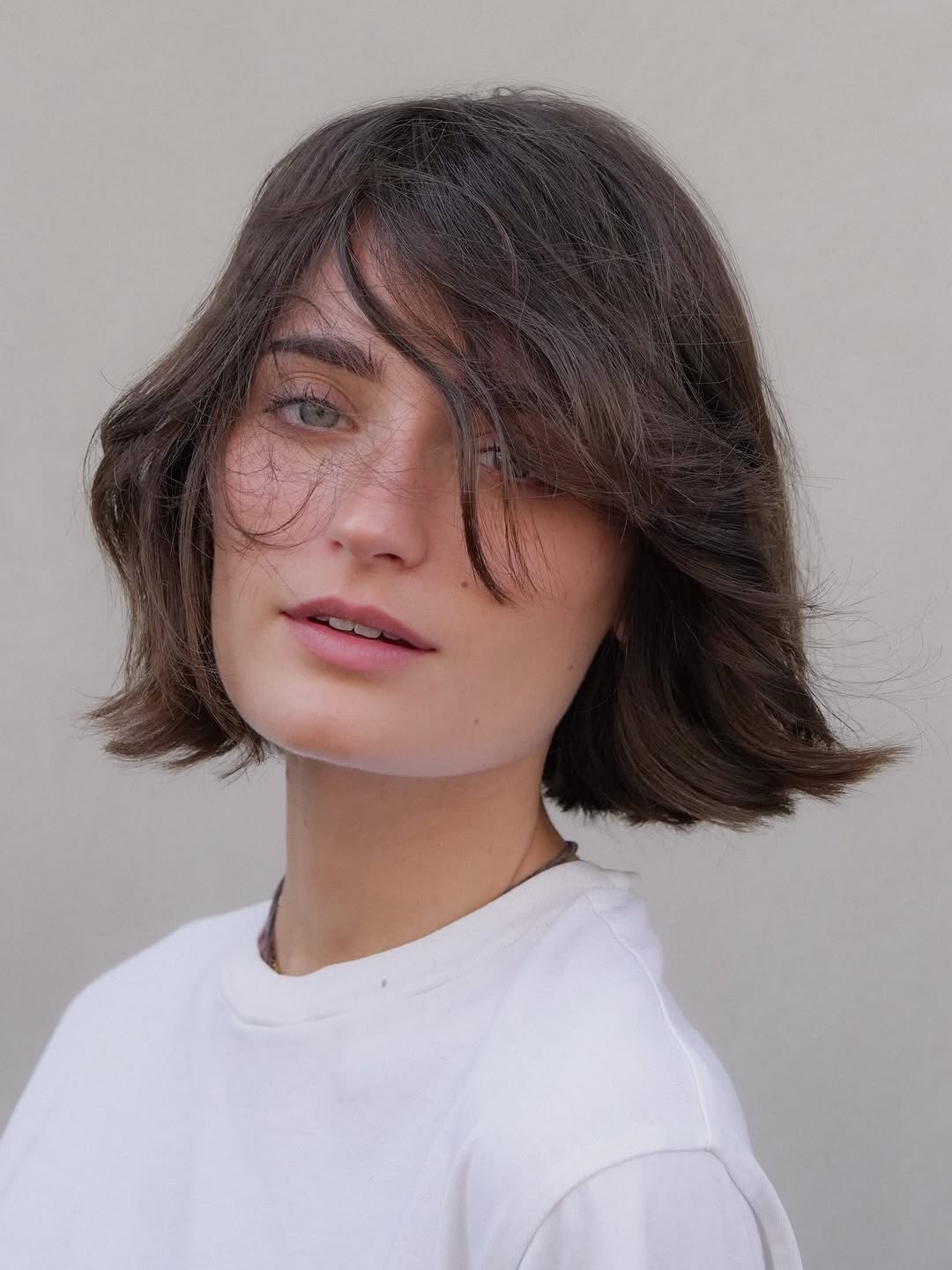 summer bob haircut 2026 Messy French-Inspired Bob with Soft Bangs