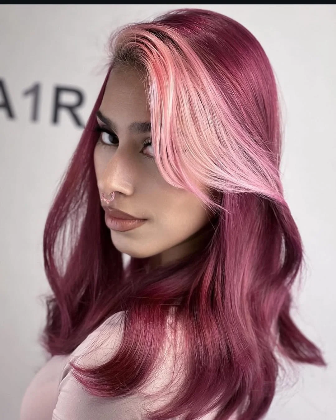 dimensional summer ombre hair color 2026 Glossy berry pink ombre with bold face frame