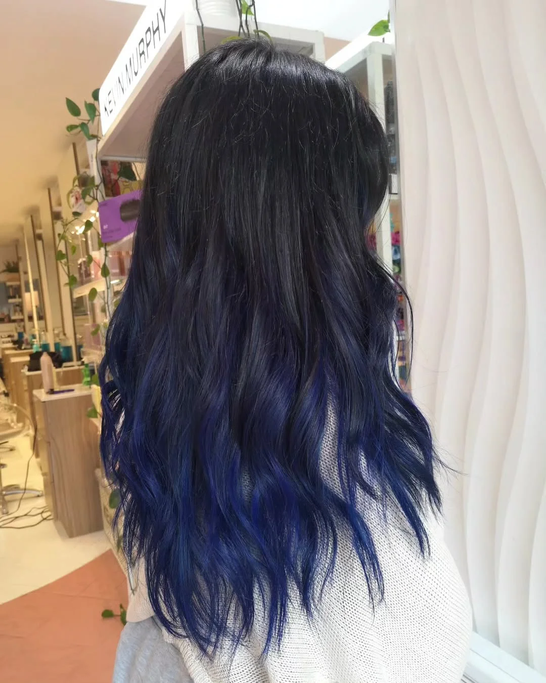 dimensional summer ombre hair color 2026 Midnight blue ombre with fluid texture