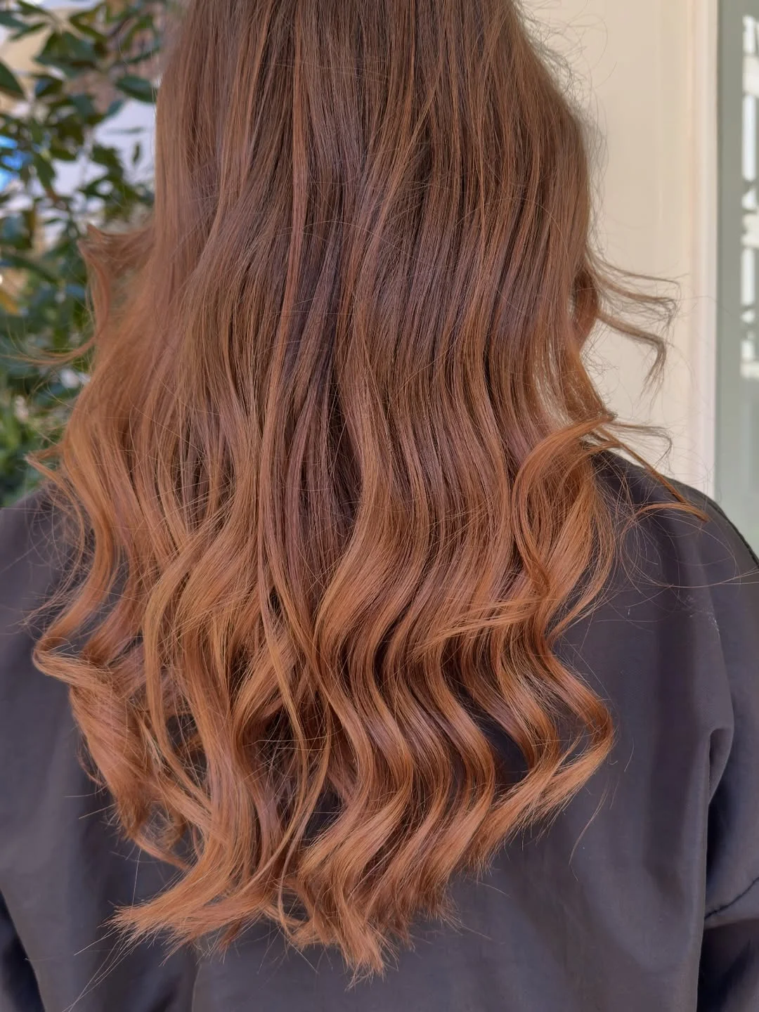 dimensional summer ombre hair color 2026 Warm brunette ombre with sunlit caramel flow
