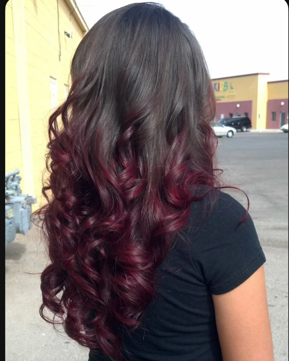 dimensional summer ombre hair color 2026 Rich burgundy ombre with defined curls