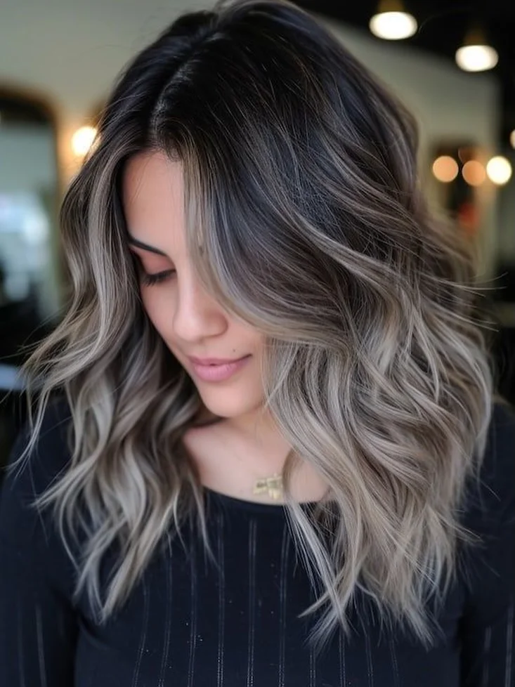 dimensional summer ombre hair color 2026 Cool-toned smoky ombre with soft waves