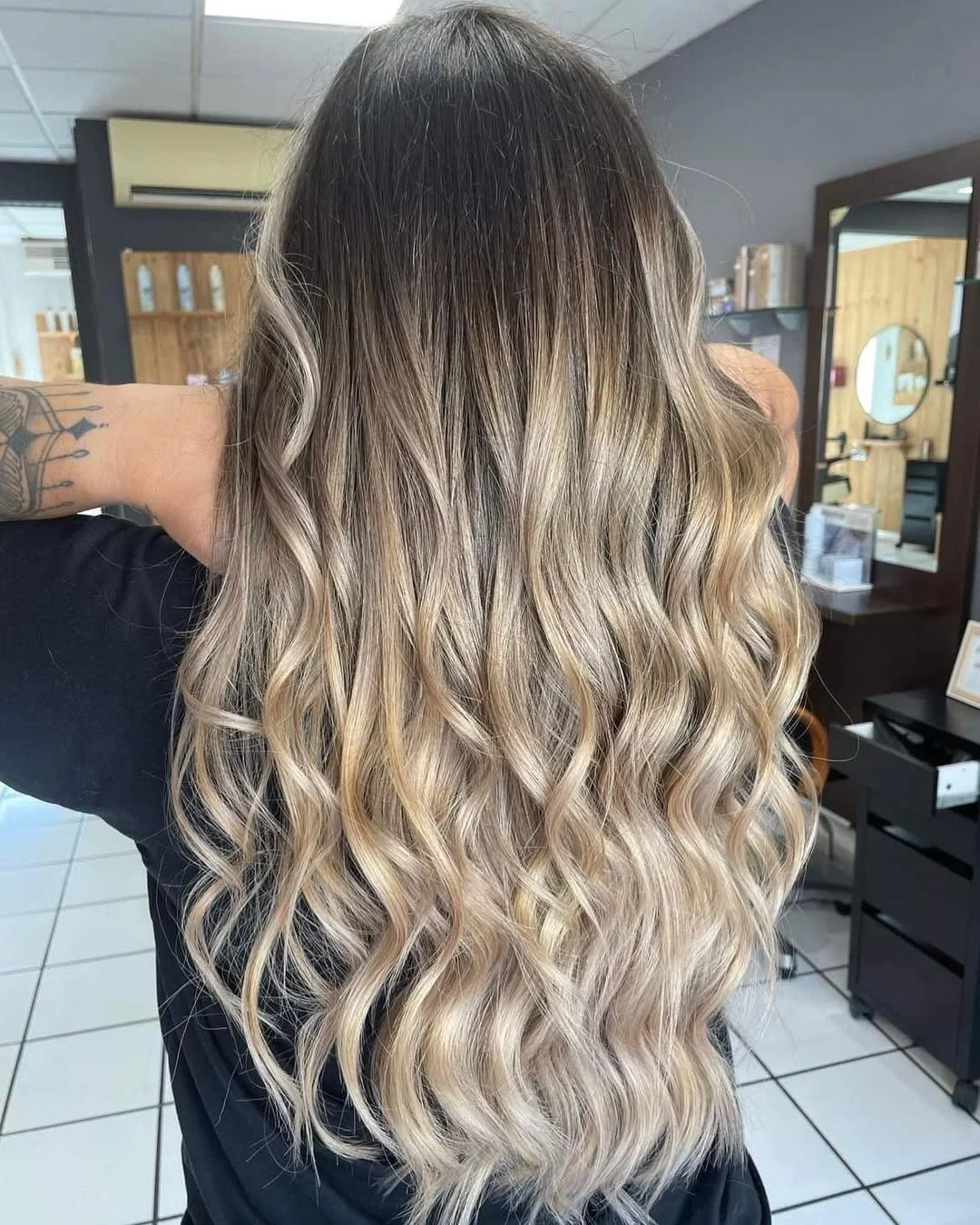 dimensional summer ombre hair color 2026 Classic brunette to blonde ombre with flowing length
