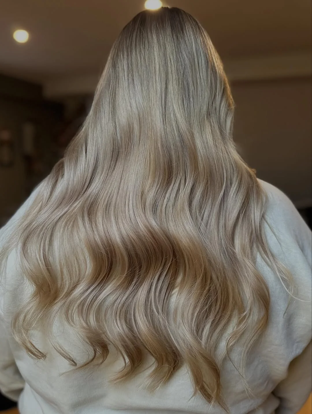 feathered summer haircuts for long hair 2026 Soft Neutral Blonde Waves with Effortless Flow