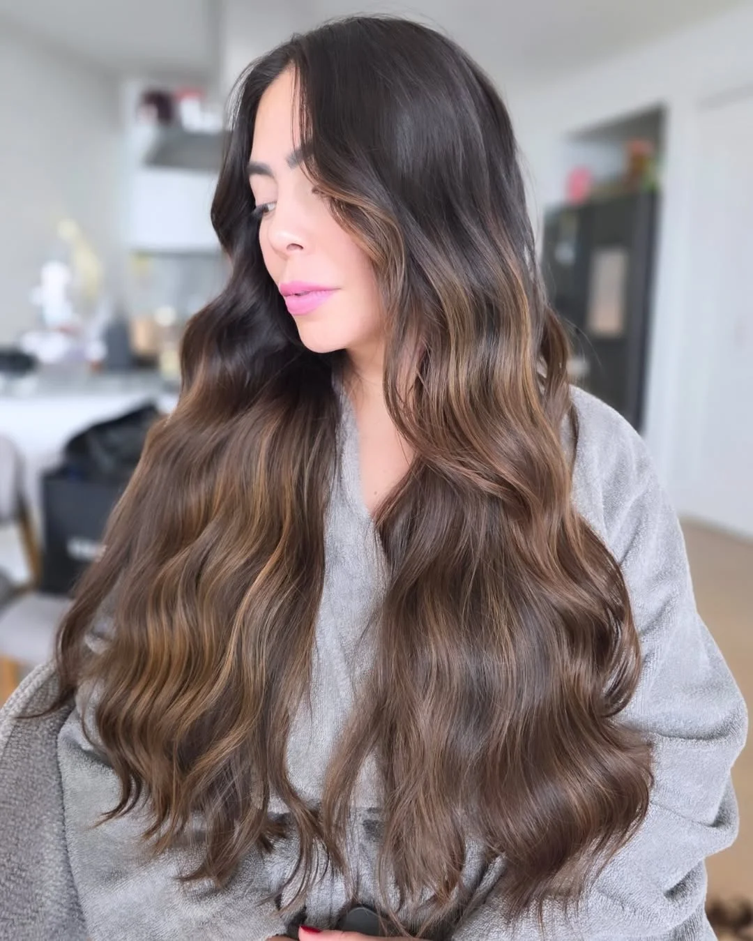 feathered summer haircuts for long hair 2026 Rich Brunette Waves with Face-Framing Flow