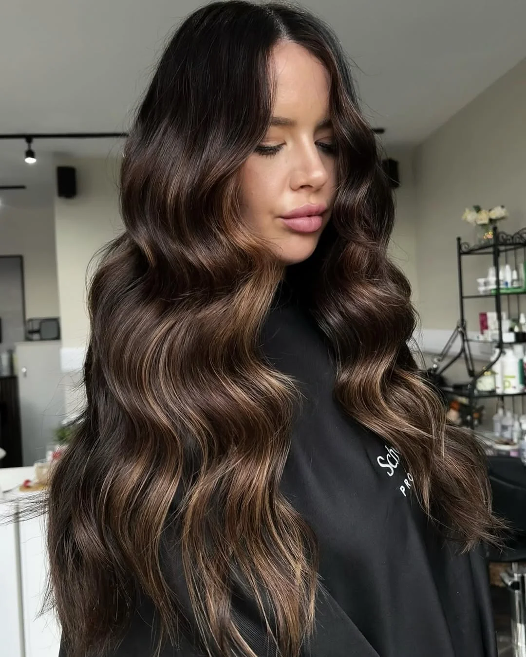 feathered summer haircuts for long hair 2026 Glossy Chocolate Waves with Soft Curtain Definition