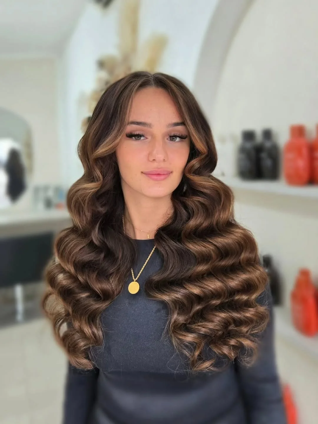 feathered summer haircuts for long hair 2026 Voluminous Chocolate Feathered Waves with Statement Movement