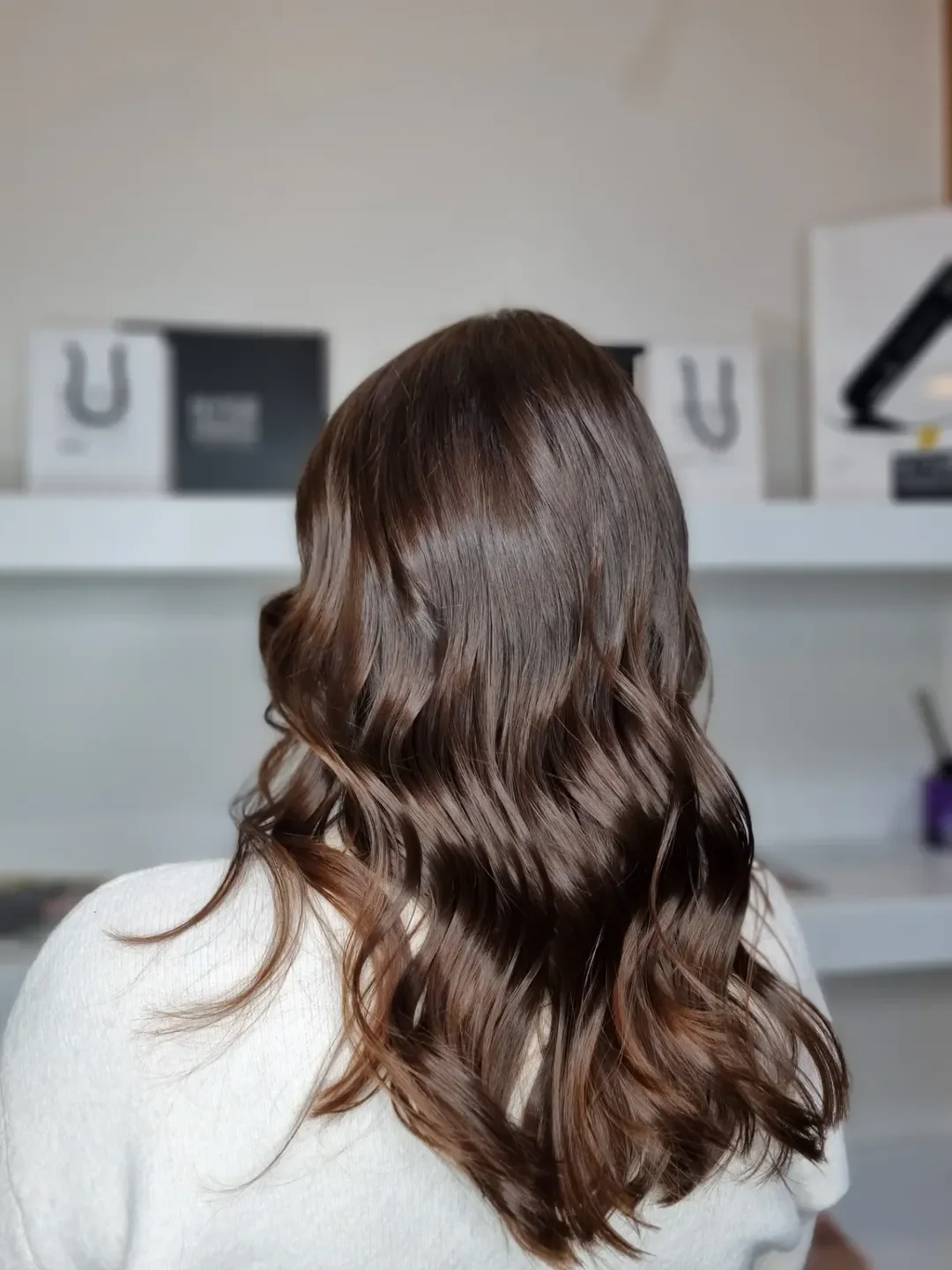 feathered summer haircuts for long hair 2026 Glossy Brunette Waves with Subtle Feathered Ends