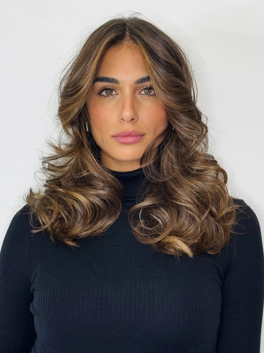 feathered summer haircuts for long hair 2026 Voluminous Feathered Blowout with Curtain Framing