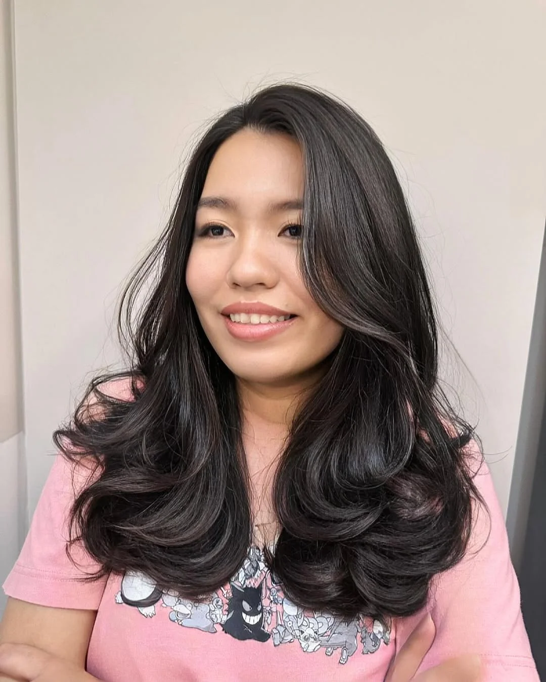 flattering summer hairstyles ideas 2026 Soft Black Layers with Voluminous Curl Flow