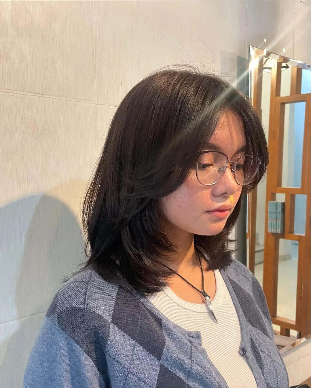 gorgeous summer haircut for round face 2026 Layered Medium Cut with Soft Curtain Bangs and Natural Flow