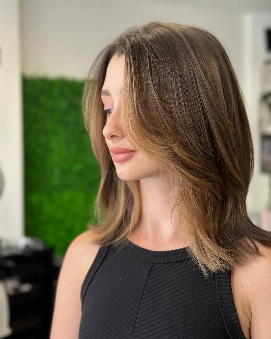 gorgeous summer haircut for round face 2026 Feathered Mid Length Layers with Soft Face Framing