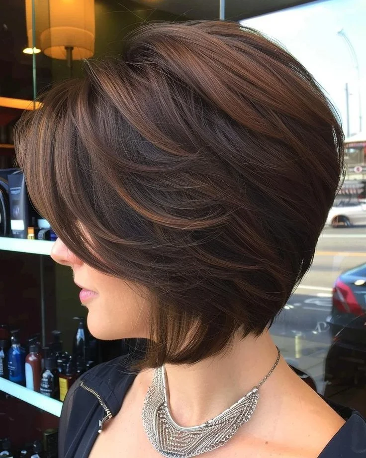 gorgeous summer haircut for round face 2026 Rounded Volume Bob with Layered Structure
