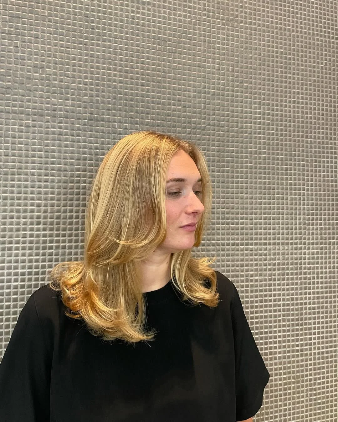 gorgeous summer haircut for round face 2026 Layered Blonde Mid Length with Flipped Ends