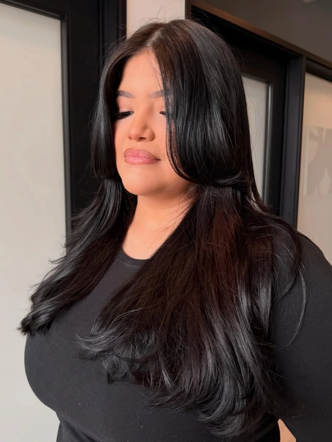 gorgeous summer haircut for round face 2026 Glossy Black Layers with Face Framing Curtain Flow