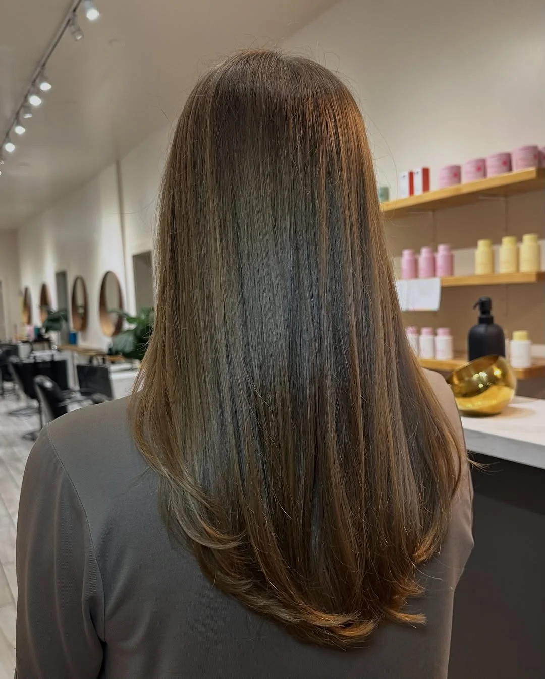 gorgeous summer haircut for round face 2026 Sleek Straight Length with Subtle Tapered Ends