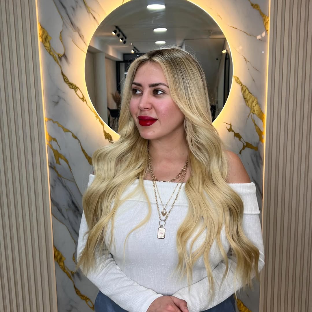 summer blonde hair color 2026 Golden Creamy Blonde Waves with Soft Glam Finish