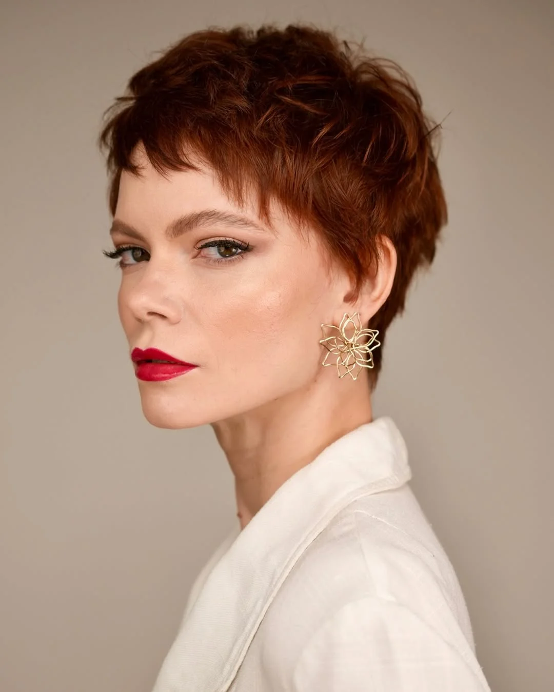 sassy summer short hairstyles 2026 Choppy Auburn Pixie with Feathered Layers