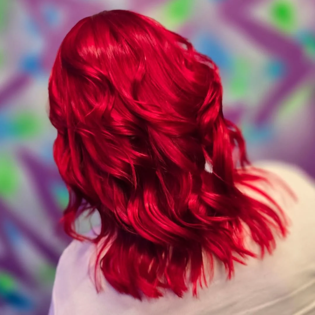 soft summer red hair color 2026 Glossy Crimson Waves with High Shine