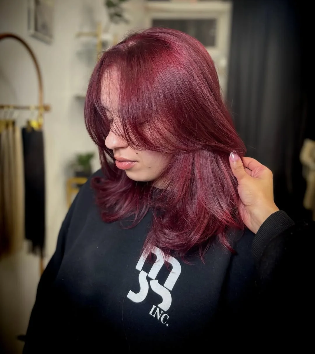 soft summer red hair color 2026 Velvet Plum Red with Feathered Layers