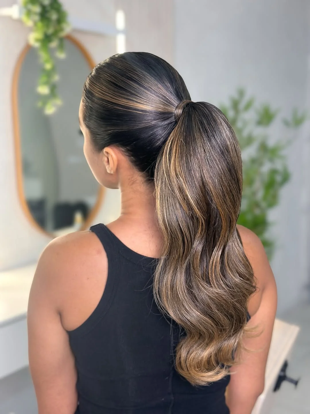 sporty summer ponytail hairstyle 2026 Glossy Mid Ponytail with Soft Waves
