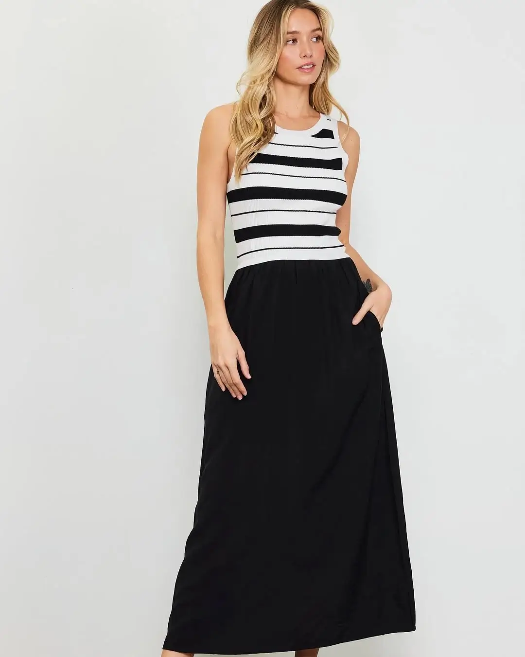 summer sleeveless tops 2026 Graphic Stripes & Fluid Skirts: Effortless Contrast That Works Every Time