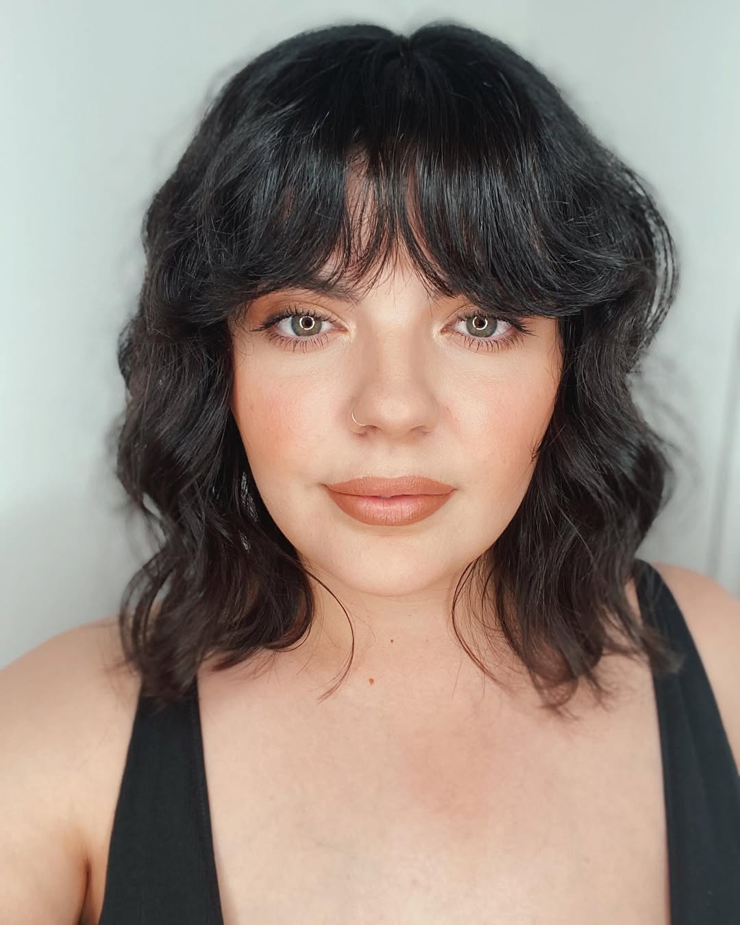 versatile summer haircut 2026 Layered Midi Cut with Soft Fringe