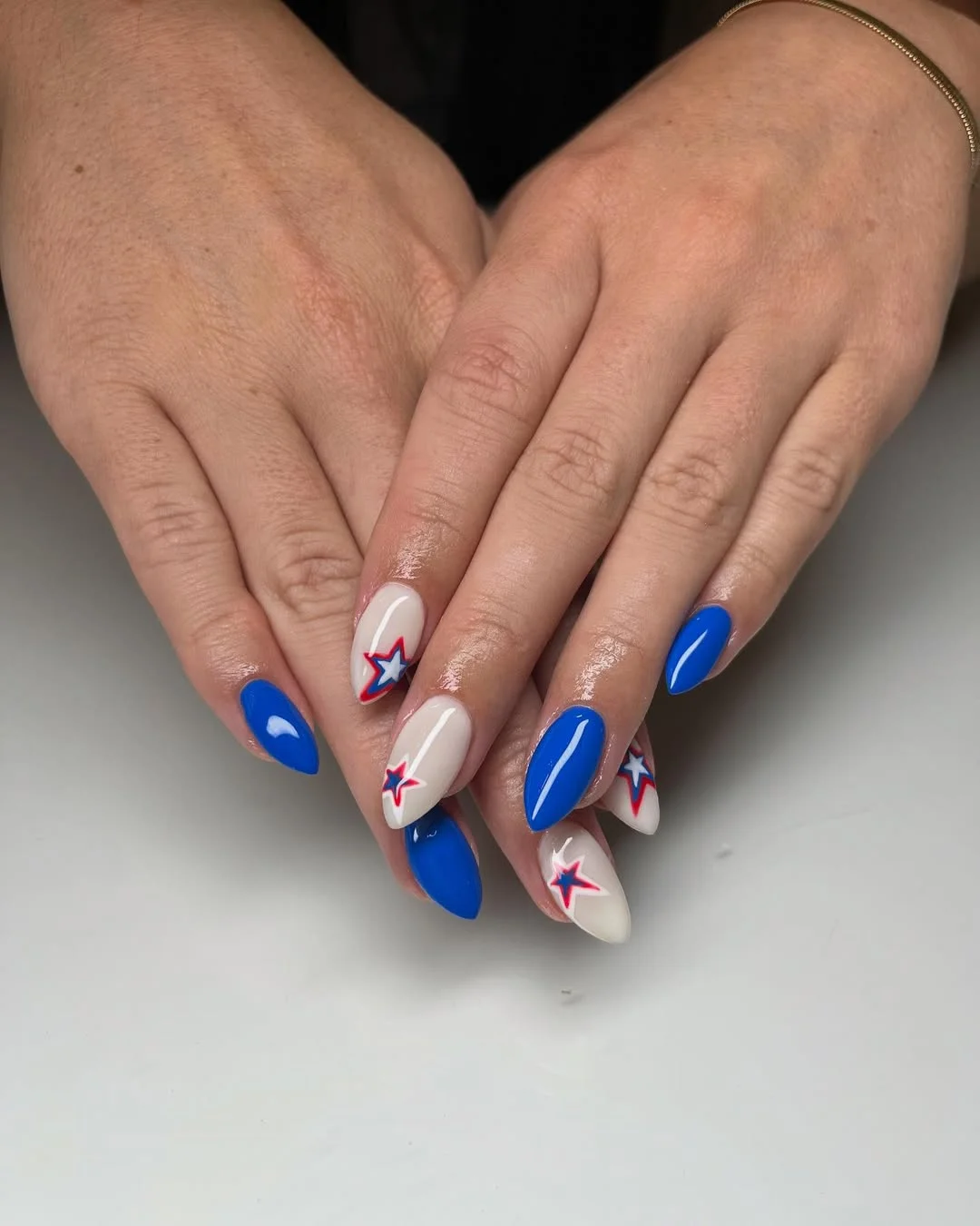 4th of july nails 2026 Minimal Patriotic Stars on Almond Nails