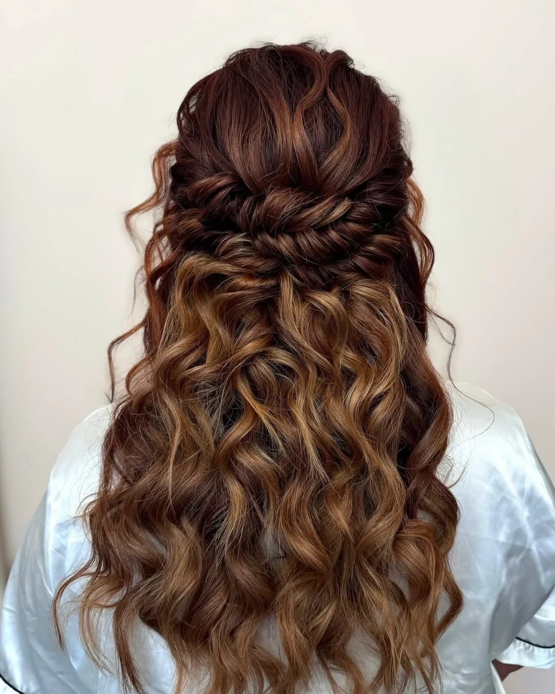 boho summer wavy hairstyle 2026 Textured Chestnut Waves with a Braided Half Up Twist