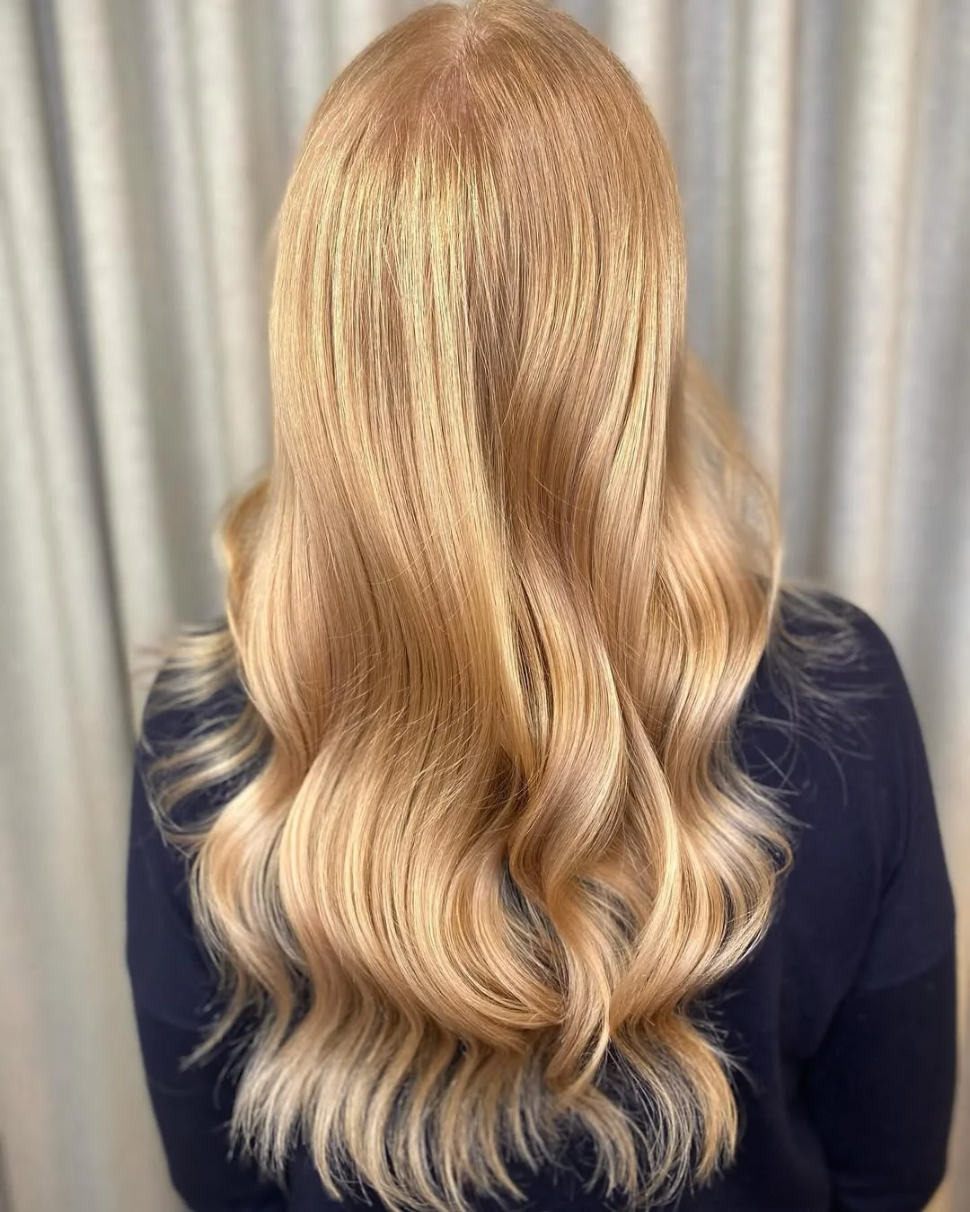 bright summer apricot blonde hair color 2026 Buttery Apricot Blonde with Soft Honey Dimension