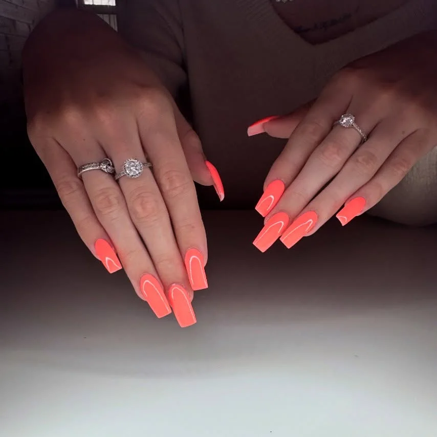 bright summer nails 2026 Neon Coral Coffin Nails That Refuse to Be Ignored