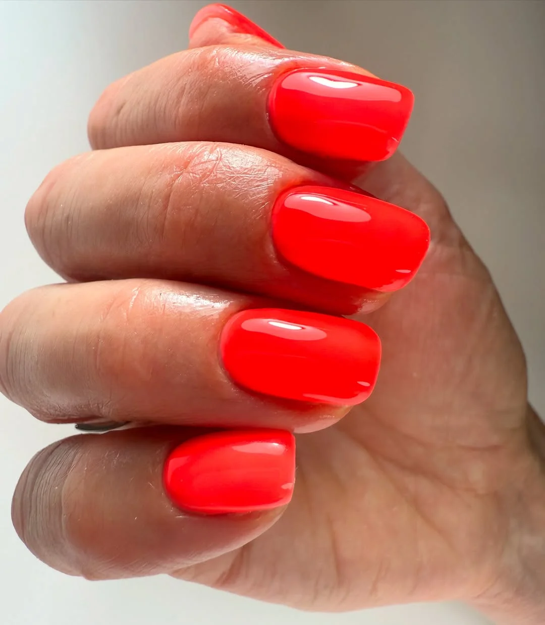 bright summer nails 2026 Fiery Coral Perfection for Minimalists