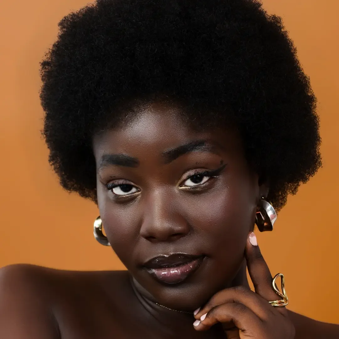 chestnut summer hair color for dark skin 2026 Classic Rounded Afro With Soft Neutral Chestnut Undertones