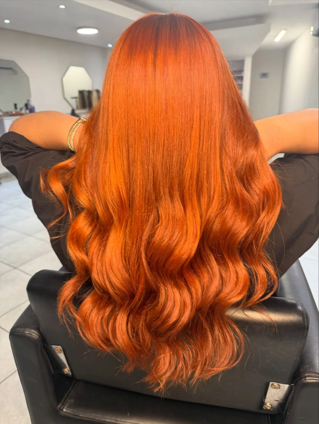 copper summer hair color for light skin 2026 Vibrant Tangerine Copper With Glossy Mermaid Waves