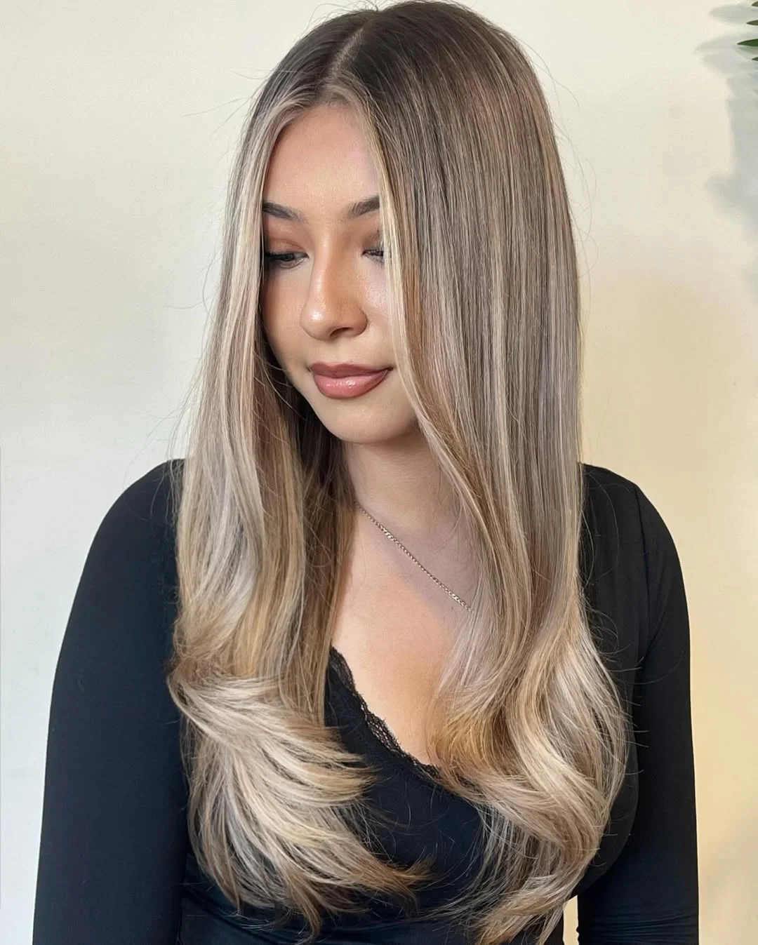effortless summer haircuts for fuller faces 2026 Bright Vanilla Blonde Layers With Feathered Ends