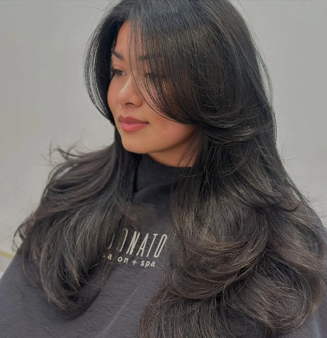 effortless summer haircuts for fuller faces 2026 Airy Black Layers With Floating Curtain Pieces
