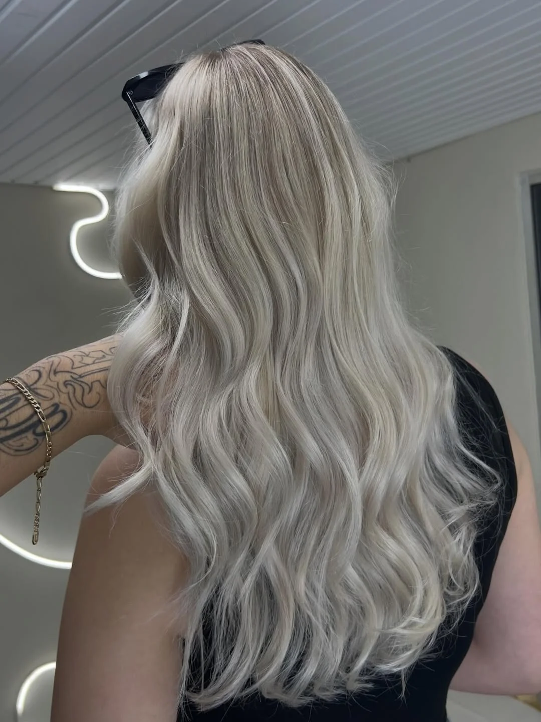 light summer ash blonde hair color 2026 Cool Ice Ash Blonde With Long Hollywood Waves