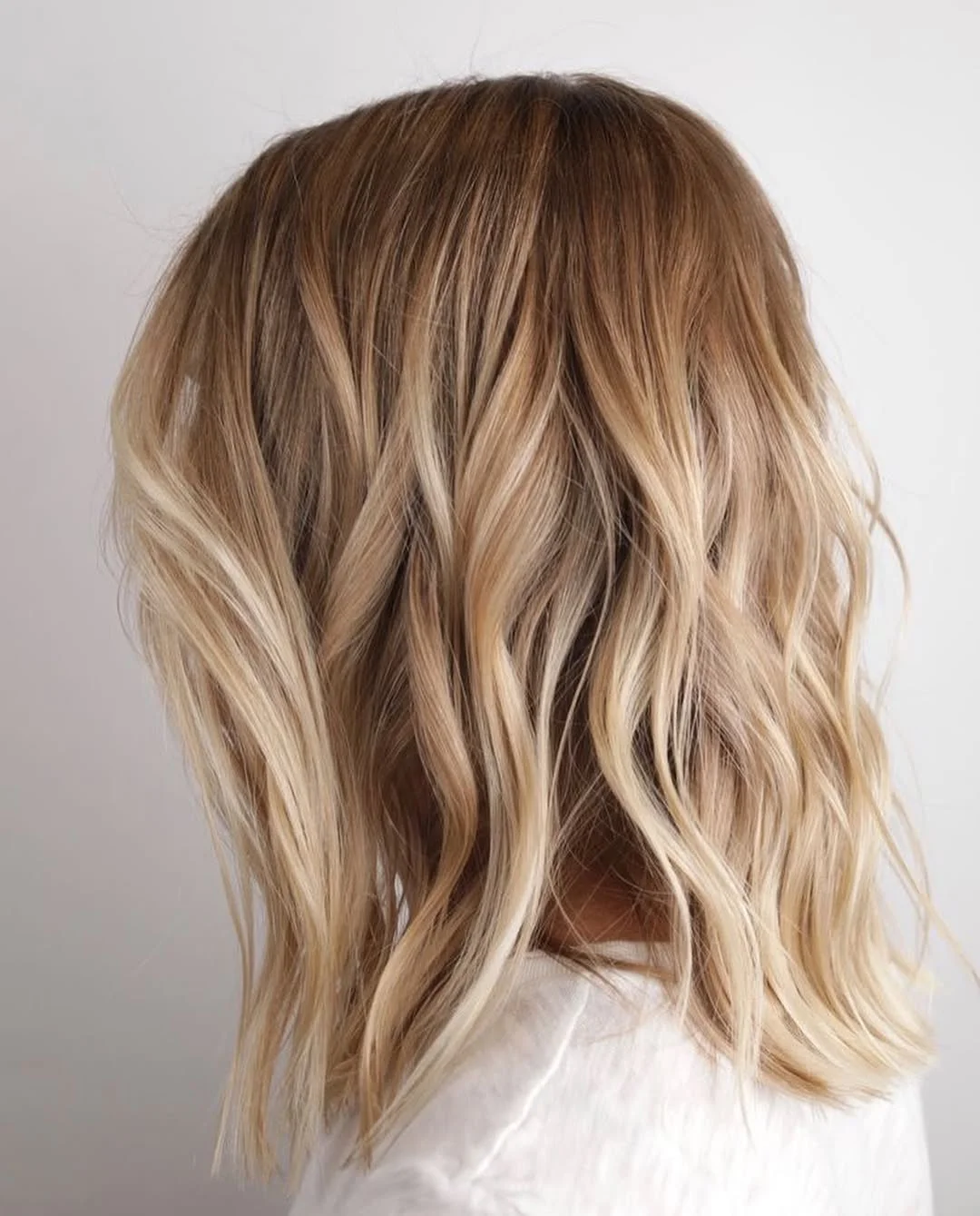 light summer honey blonde hair color 2026 Short Honey Balayage with Soft Beach Texture