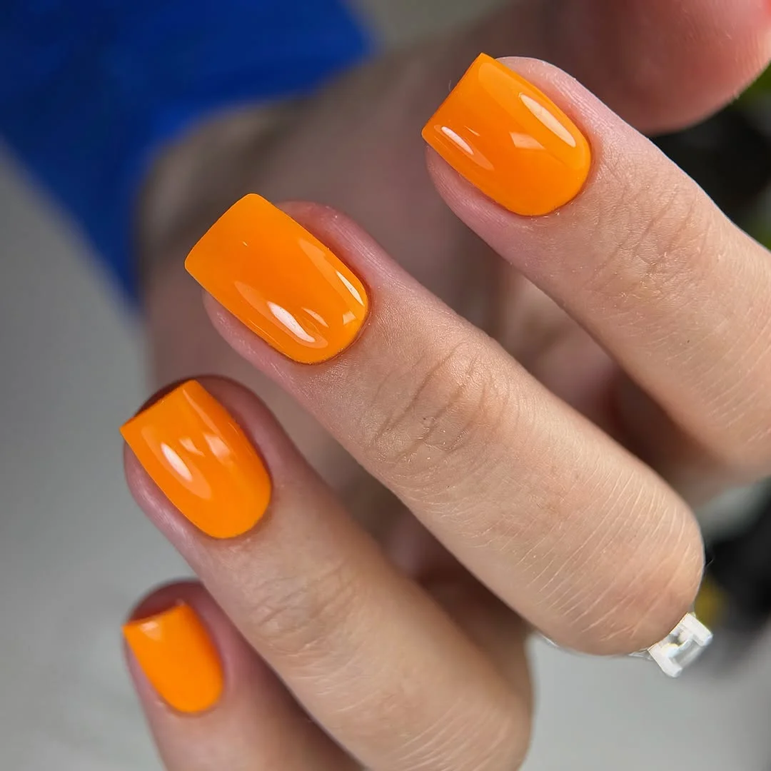 light summer nails 2026 Glossy Tangerine Nails That Instantly Wake Up Summer