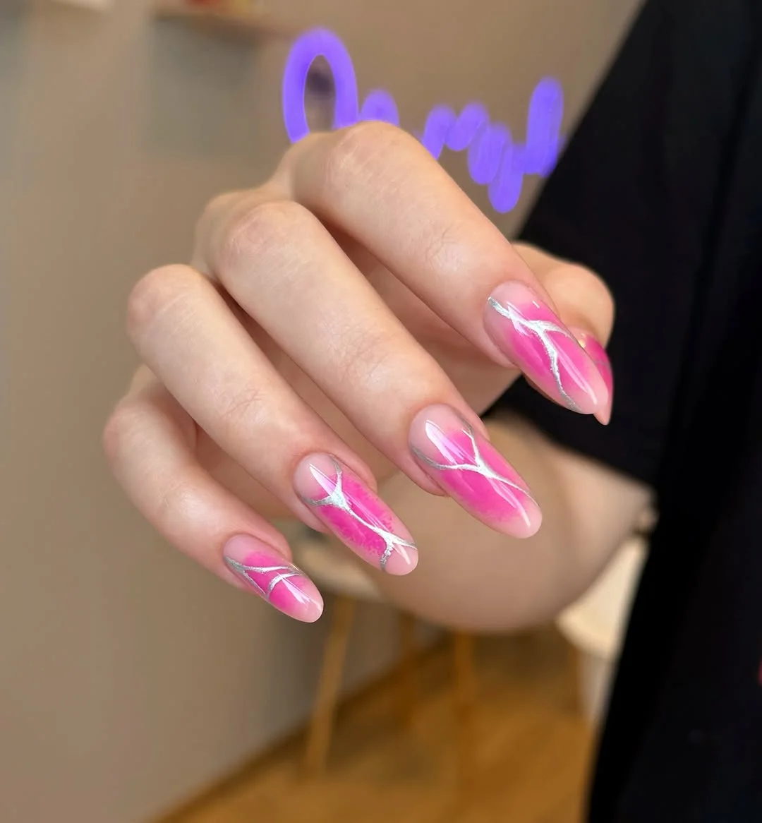 light summer nails 2026 Pink Swirl Almond Nails With Soft Metallic Accents