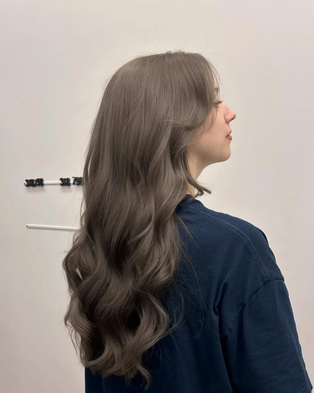 lived-in summer ash brown hair color 2026 Smoky Mushroom Waves With a Soft-Cool Finish