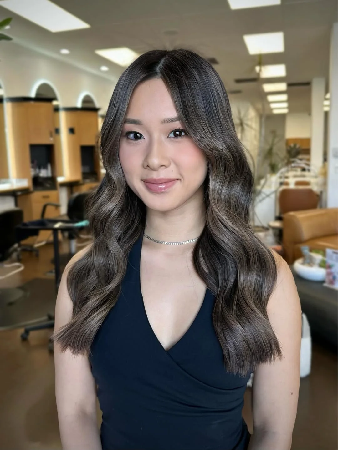 lived-in summer ash brown hair color 2026 Glossy Mushroom Ash Waves With Sleek Contrast
