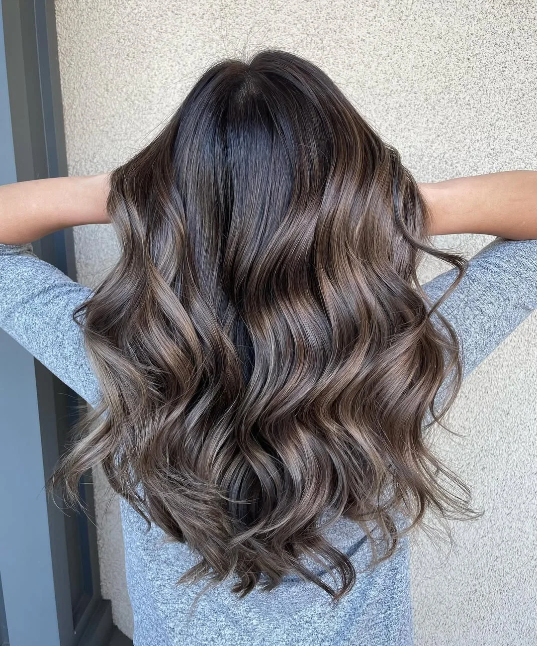 lived-in summer ash brown hair color 2026 Soft Cool Brunette With Feathered Summer Texture