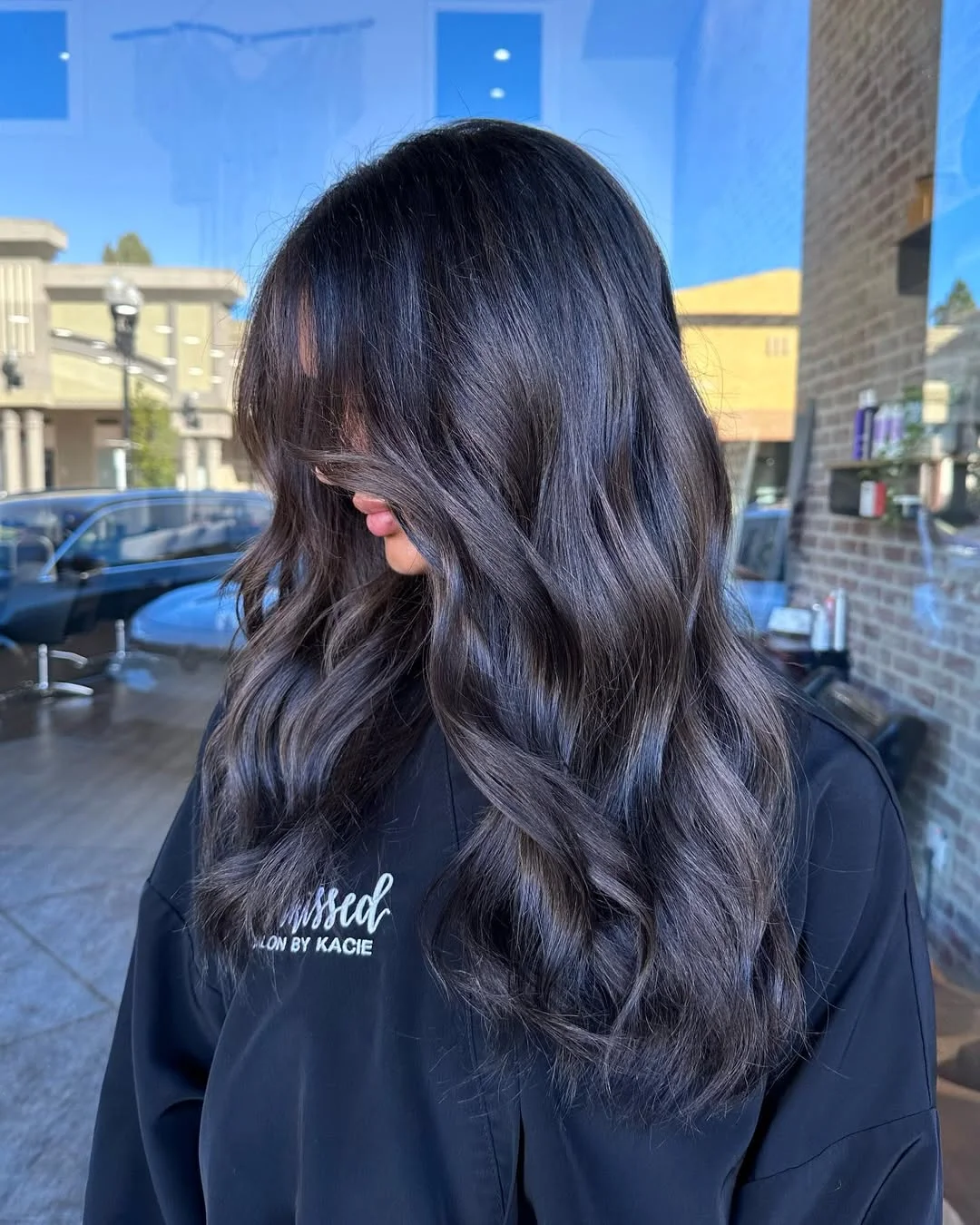 lived-in summer ash brown hair color 2026 Deep Smoky Brunette With Glossy Midnight Shine