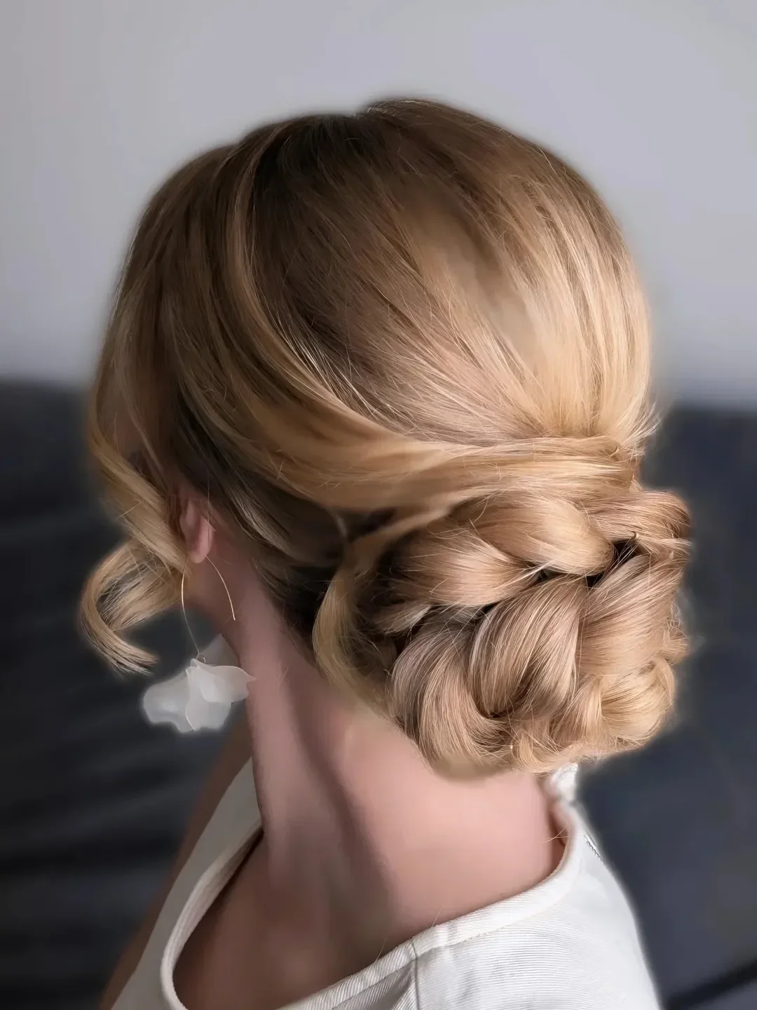 natural summer quick hairstyles 2026 Low Twisted Blonde Bun That Feels Like a Soft Escape