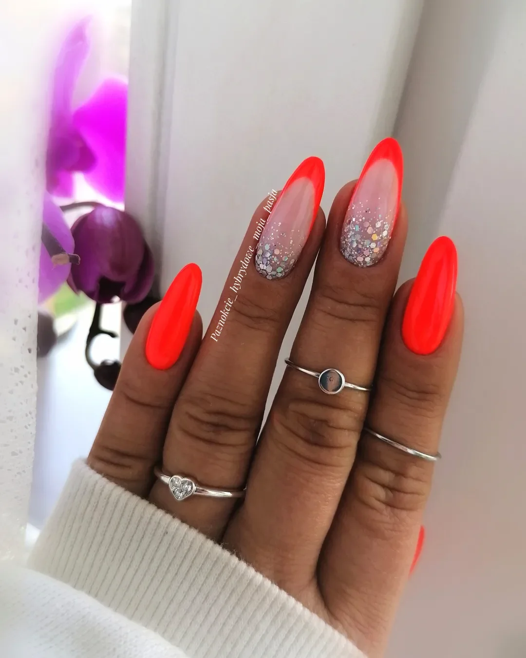 neon summer nails 2026 Electric Coral Almond Nails With Silver Sparkle Accents