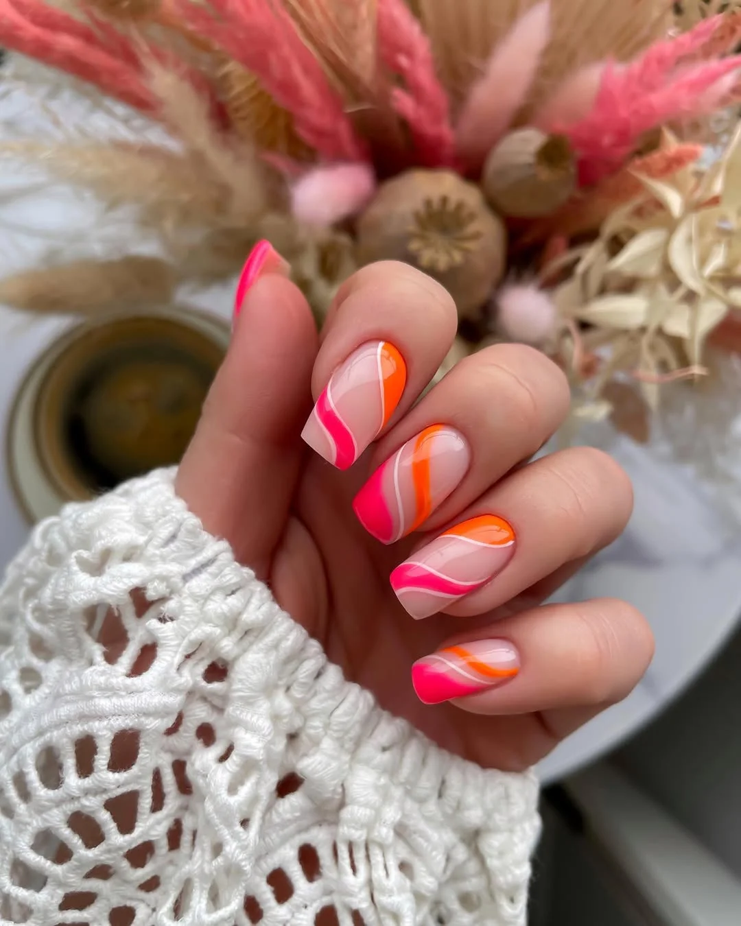 neon summer nails 2026 Pink And Orange Swirl French Tips With Retro Energy