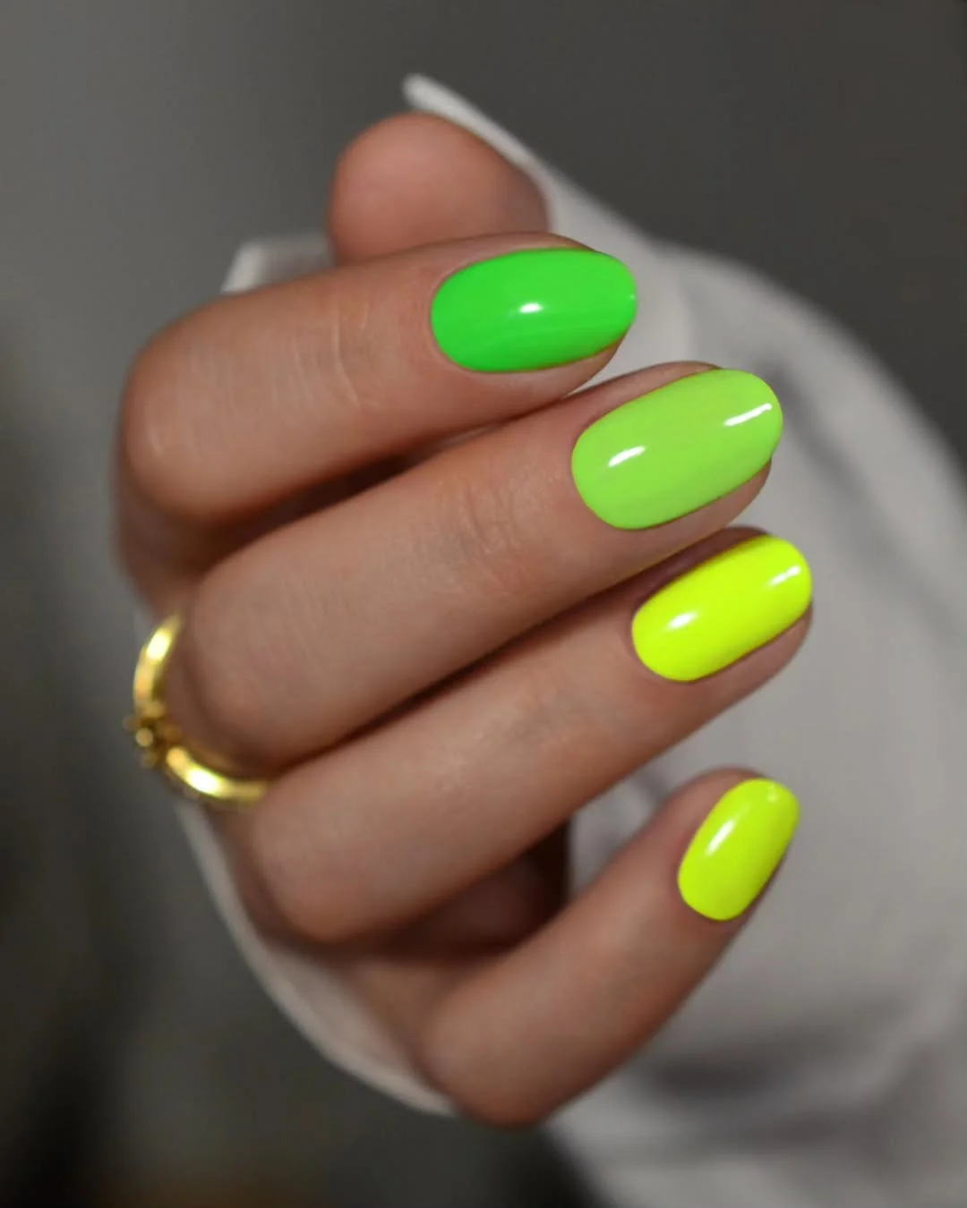 neon summer nails 2026 Mixed Neon Green Nails With A Glossy Gradient Feel