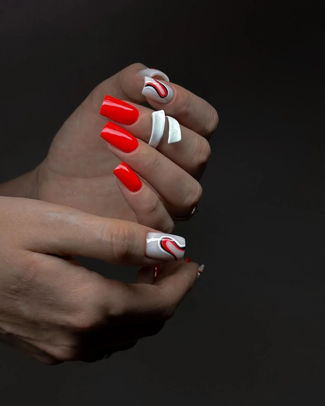 neon summer nails 2026 Glossy Red Neon Nails With Modern Swirl Accents